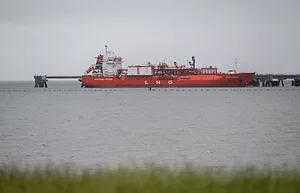 A LIQUIFIED NATURAL GAS CARRIER UNDER CONSTRUCTION AT A SHIP TERMINAL.