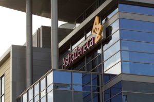 A MODERN OFFICE BUILDING BEARS A SIGN SAYING ASTRAZENECA 