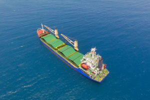 AERIAL PERSPECTIVE OF A CARGO SHIP AT SEA.