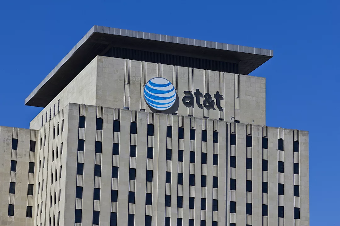 THE AT&T LOGO CAN BE SEEN NEAR THE TOP OF A CONCRETE OFFICE BUILDING. 