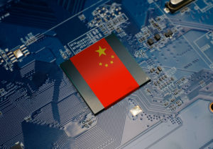 A CHINESE FLAG EMBEDDED ON THE CPU OF AN ELECTRICAL CIRCUIT BOARD.