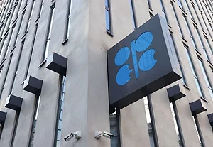 AN OPEC SIGN ON THE CORNER OF A BRICK BUILDING.