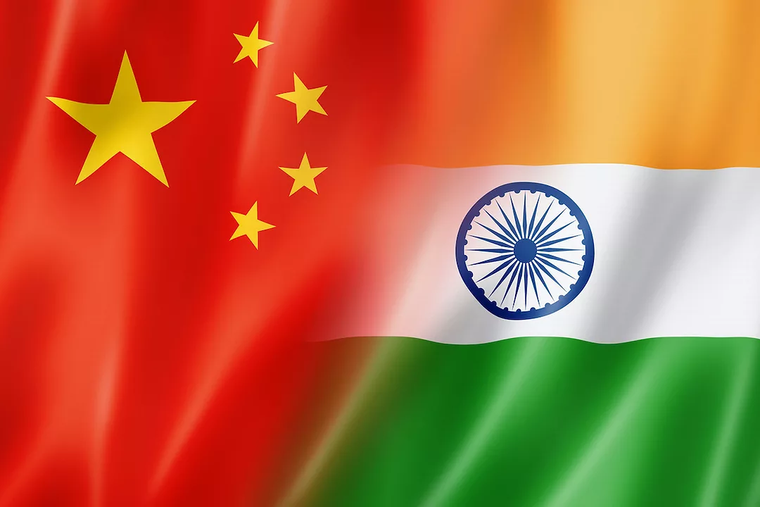 THE FLAG OF CHINA BLENDS INTO THE FLAG OF INDIA.