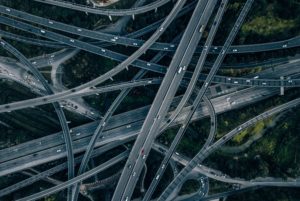 A HIGHLY COMPLEX SYSTEM OF ROADWAYS CROSSING OVER ONE ANOTHER SEEN FROM ABOVE