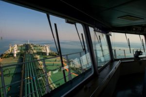VIEW FROM THE CONTROL ROOM OF AN OIL TANKER, LOOKING OUT OVER THE DECK