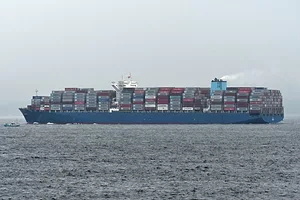A LADEN CONTAINER VESSEL PLIES THE SEAS.