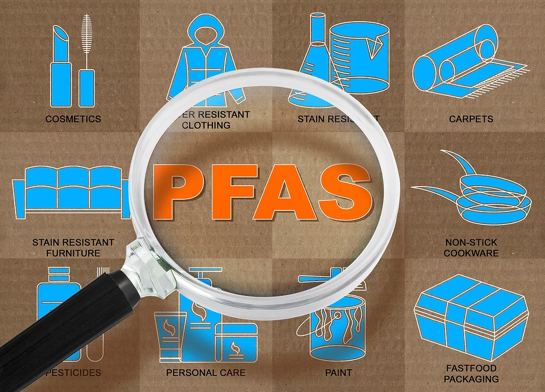 A magnifying glass over the word "PFAS"