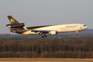 A UPS airplane taking off from a runway