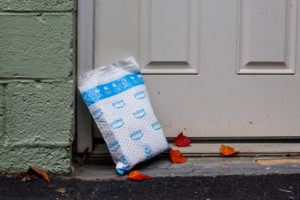 An Amazon package sitting on a doorstep