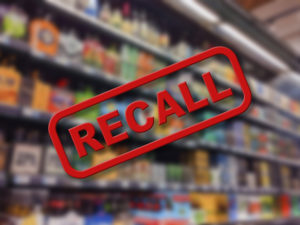 Recall text over a blurred background of a grocery store aisle