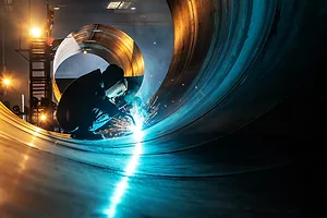 A man welding steel plates