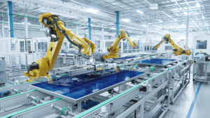 A manufacturing facility with robotic arms assembling solar panels