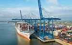 A container ship with cargo docked at the Port of Charleston
