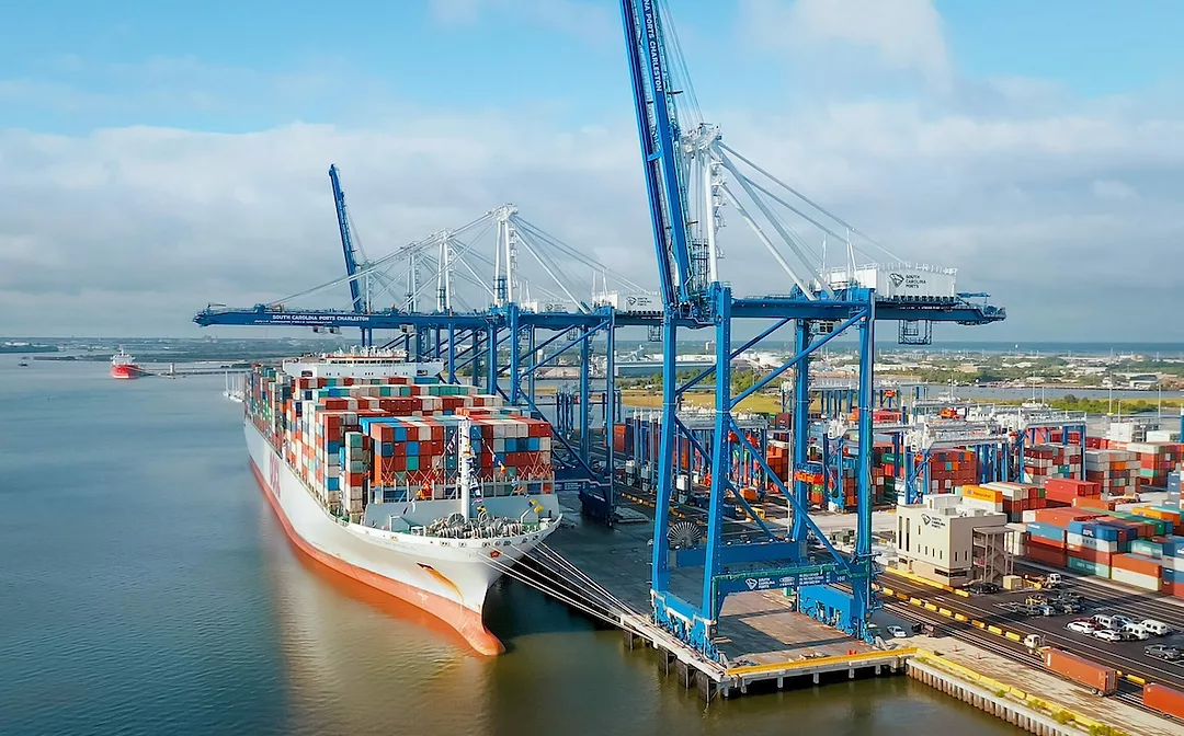 A container ship with cargo docked at the Port of Charleston