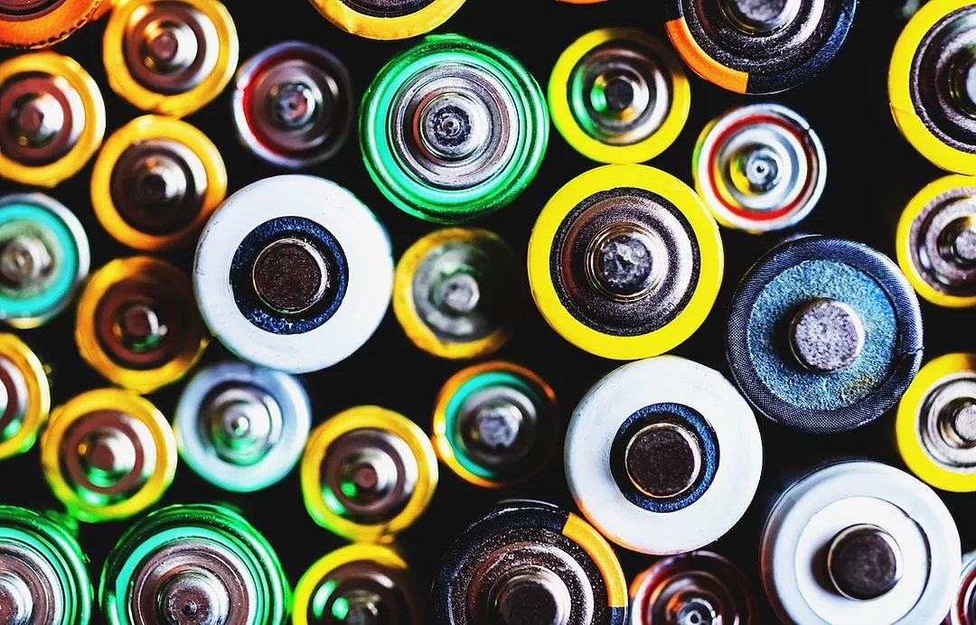An overhead view of a collection of multicolored lithium-ion batteries
