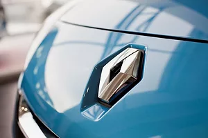 A BRIGHT BLUE CAR HOOD BEARS THE RENAULT INSIGNIA