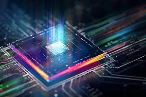 A blue square microchip with neon rainbow colors along its edges, with a blue and purple beam emitting from the center