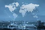 A visualization of a world map with lines connecting countries, interposed in the sky above a cityscape along the water, with the whole image tinted light blue