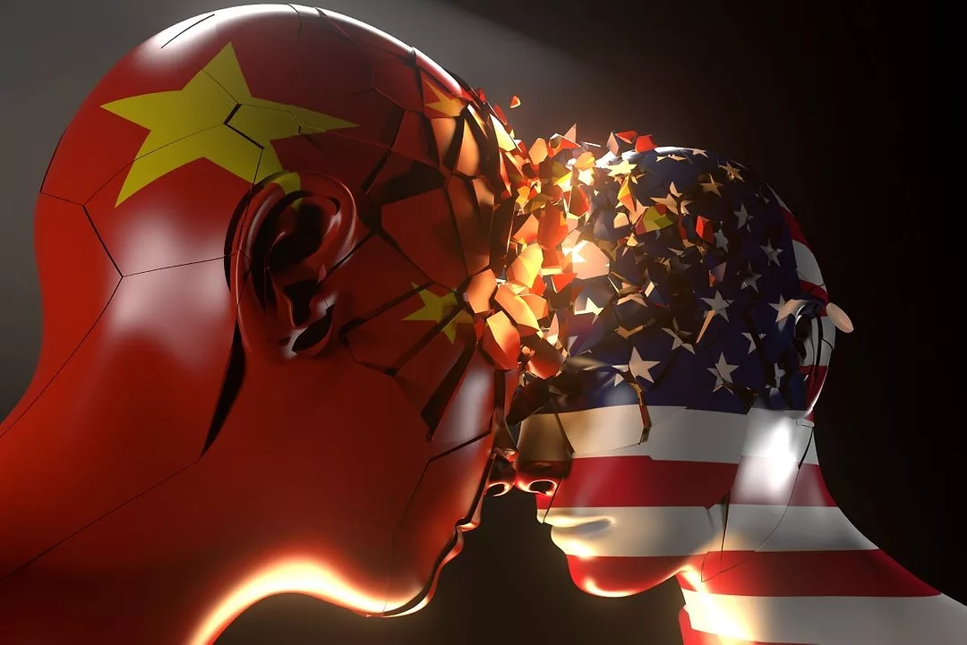 TWO MANNEQUIN HEADS, ONE IN THE COLORS OF THE CHINESE FLAG, THE OTHER IN THE COLORS OF THE AMERICAN FLAG, PRESS THEIR HEADS TOGETHER, PRODUCING SHINING DATA FLAKES