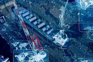 AERIAL VIEW OF A SHIPYARD SUPERIMPOSED WITH CYBERSECURITY SYMBOLS