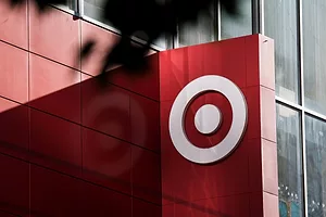 A LIGHTED SIGN ON A WALL BEARS THE TARGET LOGO