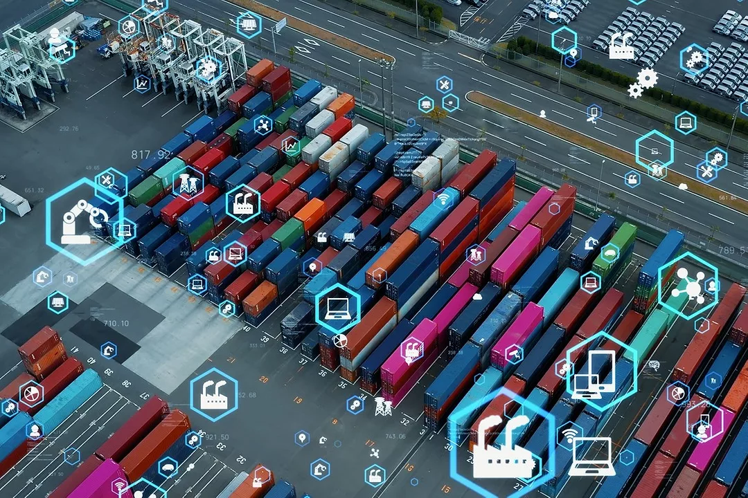 MULTI-COLORED CONTAINERS SIT ON A DOCK, OVERLAID WITH DIGITAL TRACKING IMAGES
