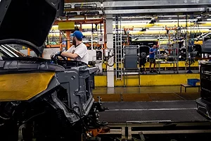 A WORKER ON AN ASSEMBLY LINE