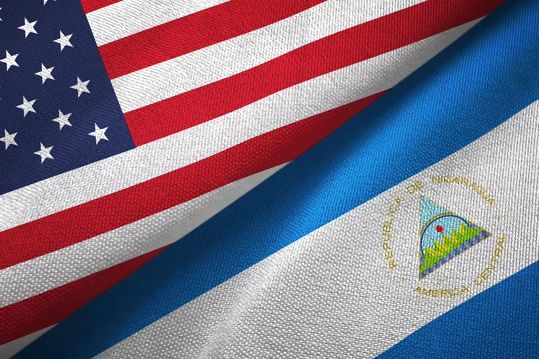 The United States and Nicaraguan flags interposed against each other
