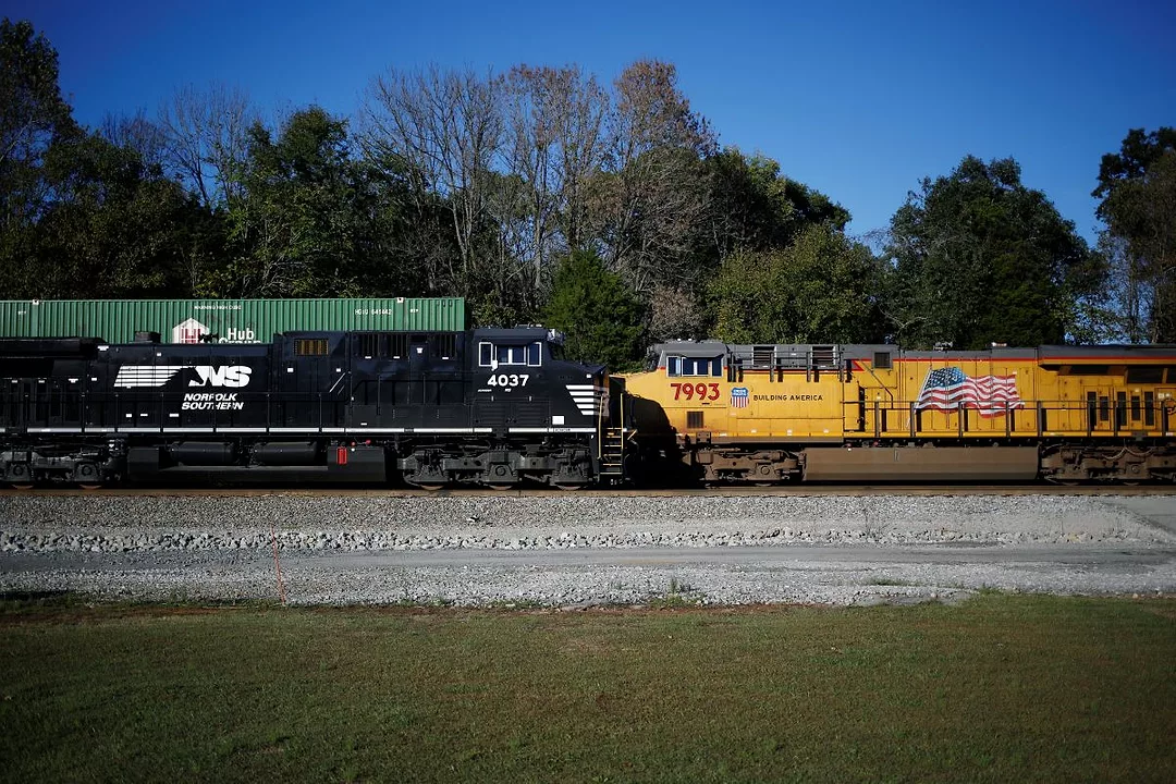 TWO TRAIN ENGINES FACE EACH OTHER ON THE TRACK