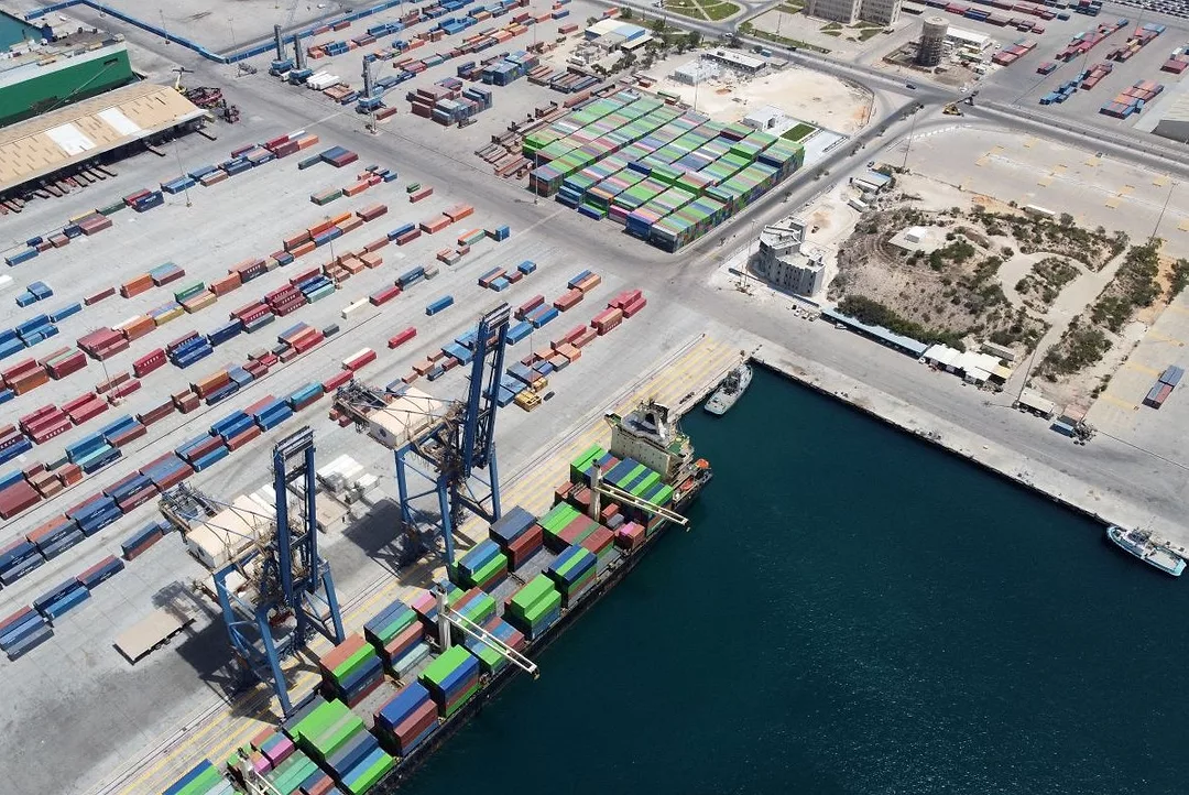 AN AERIAL VIEW OF A PORT, WITH DOCKS AND CRANES