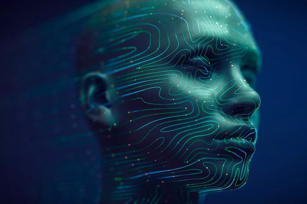 A HUMAN HEAD IS COVERED IN BRIGHT BLUE LINES OF LIGHT