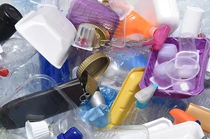 A PILE OF DISUSED PLASTIC PACKAGING
