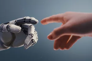 A human hand reaching out to a white robotic hand