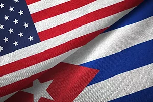 The U.S. and Cuban flags juxtaposed against each other