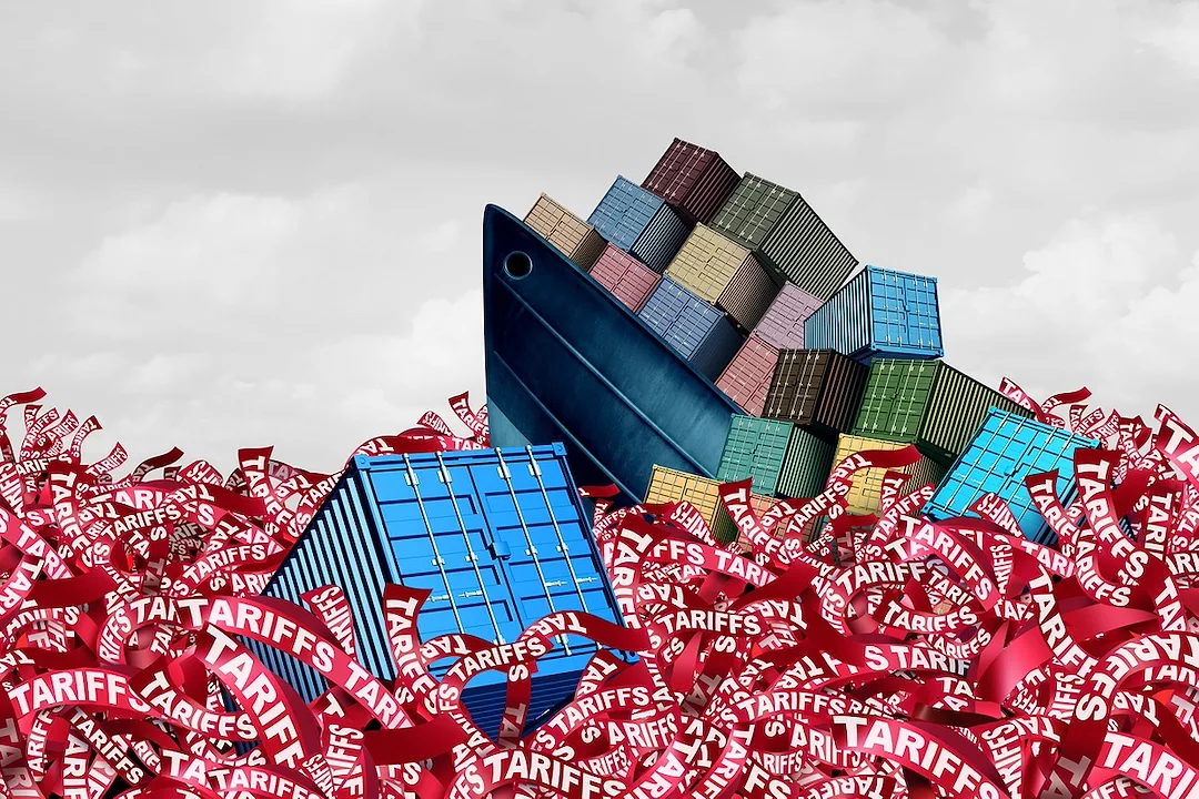 A blue container ship stacked with multi-colored containers sinking into an ocean of red tape that reads "tariffs"