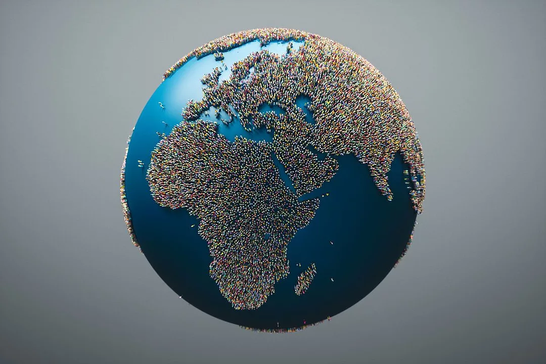 People forming landmasses on a globe of the earth