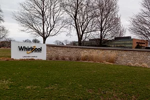 A SIGN ON A WALL BORDERING A CORPORATE CAMPUS BEARS THE NAME WHIRLPOOL