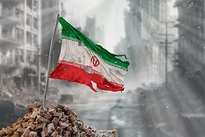 Dirty and torn, an Iranian flag is planted amid the rubble of the ruins of a city.