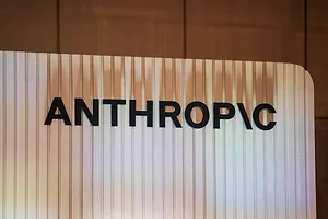 A white lit-up wall that reads "ANTHROPIC" in black lettering
