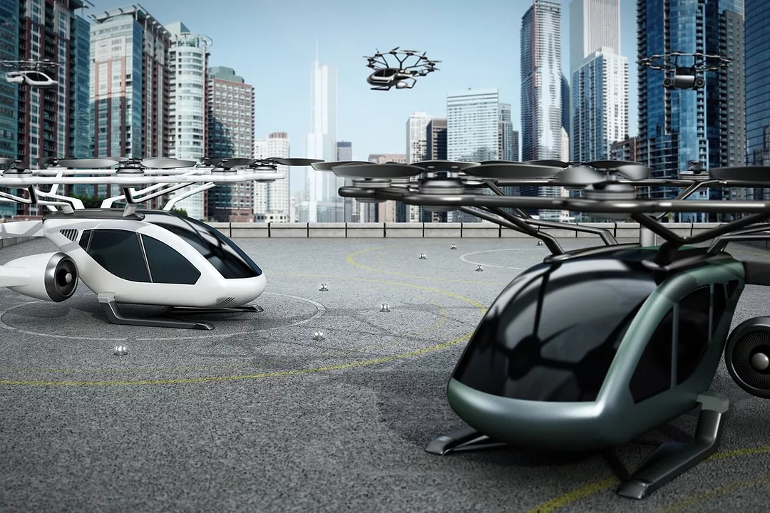 Artist's concept of eVTOL (electric vertical take-off and landing) aircrafts as a taxi/shuttle service at the helipad on top of a building