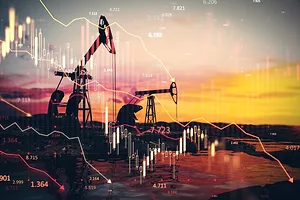 A row of large oil mining pumps at sunset, with imagery of financial charts across the foreground