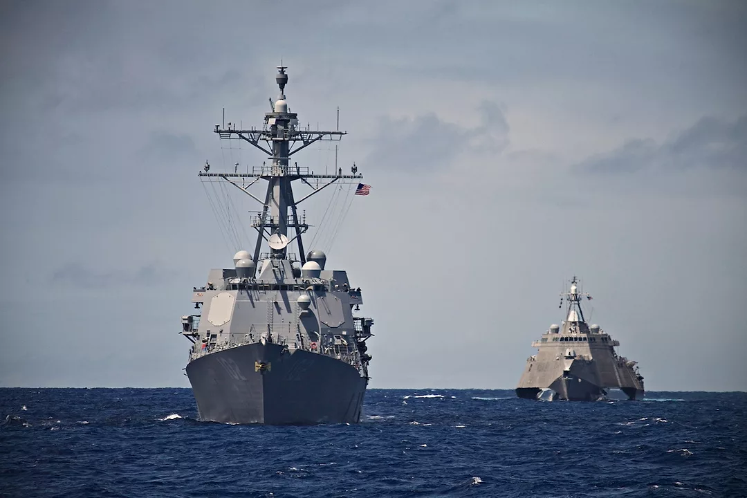 A pair of grey U.S. Navy destroyers at sea