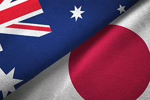The Australian and Japanese flags interposed against each other