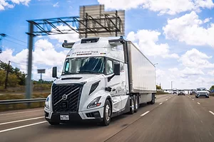 A white semi-truck on a highway