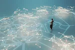 oung man walking and listening to music in VR environment of bright lines stretching out in enormous complexity