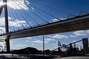 THE STRUT OF A LARGE SUSPENSION BRIDGE IS VIEWED FROM BELOW