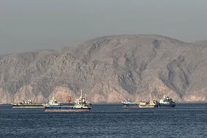 SHIPS ON A DEEP BLUE SEA, DESERT HILLS IN THE BACKGROUND
