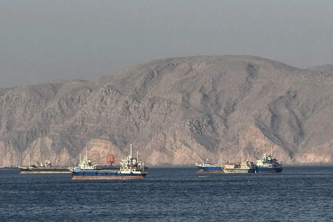 SHIPS ON A DEEP BLUE SEA, DESERT HILLS IN THE BACKGROUND