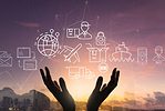 LOGISTICS NETWORK DESIGN iStock-greenbutterfly-1363749462.jpg A pair of hands reaches towards a cluster of icons showing global logistics network distribution and transportation