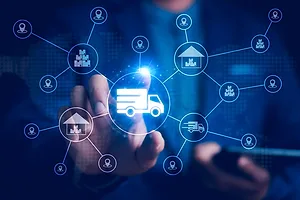 A businessman interacts with a digital ecosystem of truck freight, warehousing, and e-commerce, 